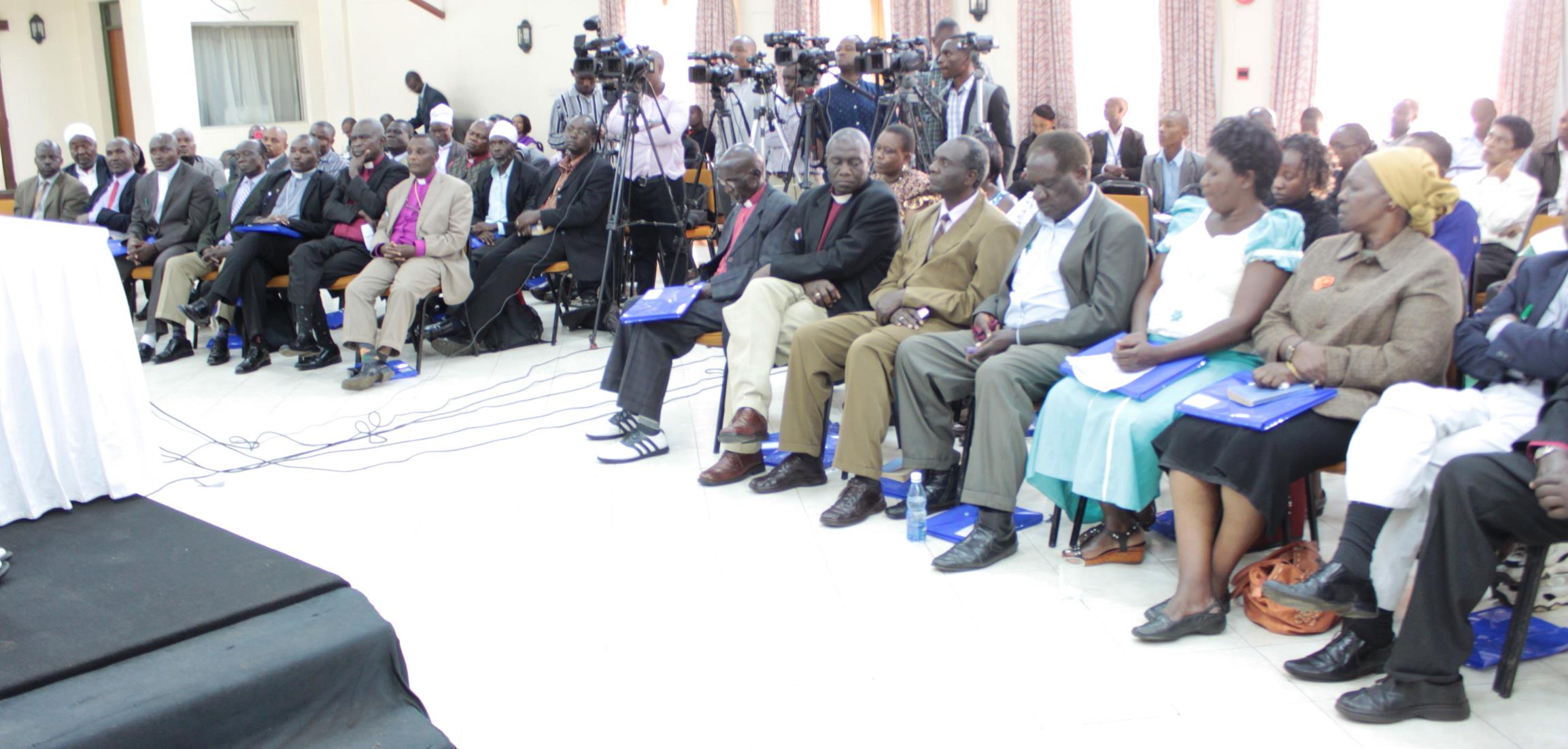 Members of EXCOM follow the proceedings during a media conference